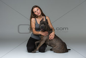 Beautiful girl with grey stafford terrier