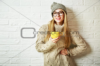 Happy Hipster Fashion Girl in Winter with a Mug