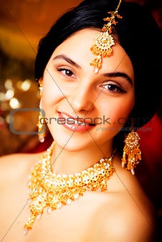 beauty sweet real indian girl in sari smiling on black backgroun