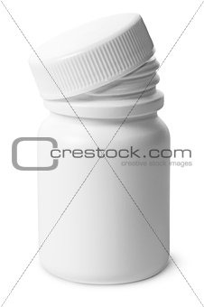 Single plastic bottle with cover removed for pills