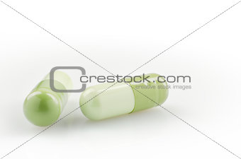 Two Green Capsules