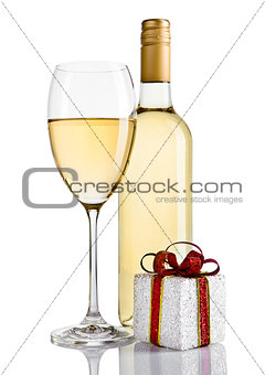 Bottle and glass of white wine and gift box
