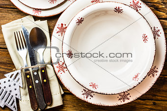 Christmas table setting on wooden background. Top view