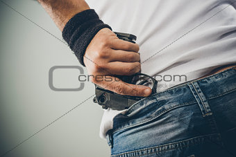 Man grabbing his pistol