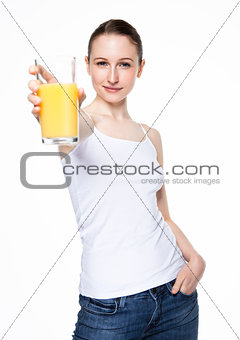 Beautiful woman holding glass with orange juice