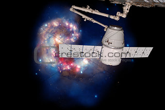 SpaceX Dragon over spiral galaxy.