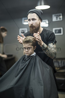 Kid's hair styling in barbershop