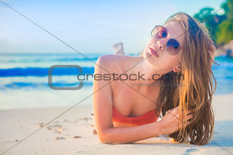 pretty long haired woman relaxing on tropical beach. Mahe, Seychelles