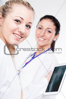 two women are smiling doctors 