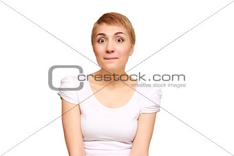Woman surprise holds cheeks by hand .Beautiful girl with curly hair pointing to looking right . Presenting your product. Isolated on white background. Expressive facial expressions