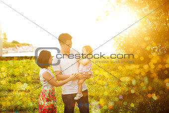 Family having fun at outdoor sunset