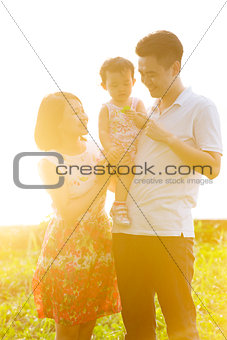 Family outdoor portrait in sunset