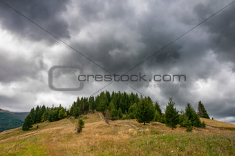 Beautiful dramatic clouds over autumn mountains. Carpathian mountains. Ukraine.