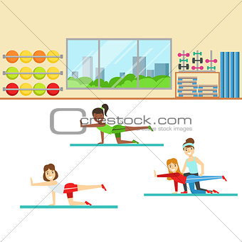 Yoga Class With Trainer Helping And Correcting , Member Of The Fitness Club Working Out And Exercising In Trendy Sportswear