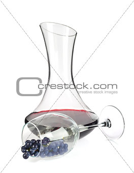Decanter with wine and grapes in wineglass