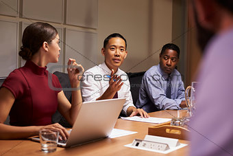 Business colleagues in discussion at a meeting, close up