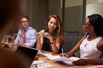 Business colleagues at a meeting in boardroom, close up