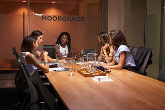 Businesswomen in discussion at an evening meeting