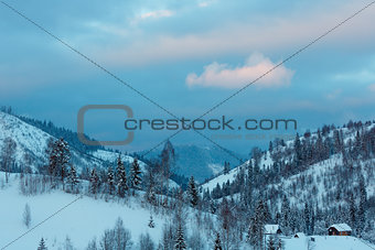 Sunset winter Ukrainian Carpathian Mountains landscape.