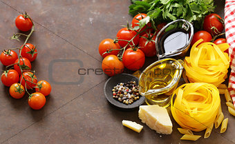 Italian food ingredients - vegetables, olive oil, spices and parmesan cheese