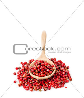 Pepper red peppercorns in wooden spoon.
