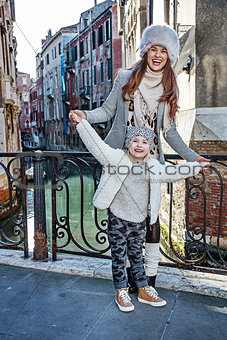 mother and daughter tourists in Venice having fun time