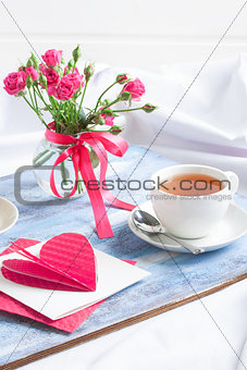 Morning Valentine's breakfast on blue wooden tray