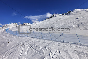 Ski track in sun winter day