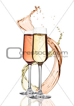 Glasses of yellow and pink champagne with splashes