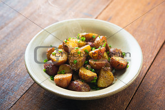 Oven roasted potatoes on wood table