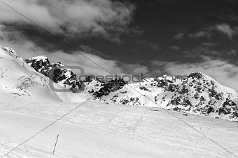 Black and white ski slope at sun winter day