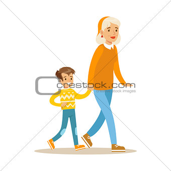 Grandmother Walking With Boy Holding Hands, Part Of Grandparents Having Fun With Grandchildren Series