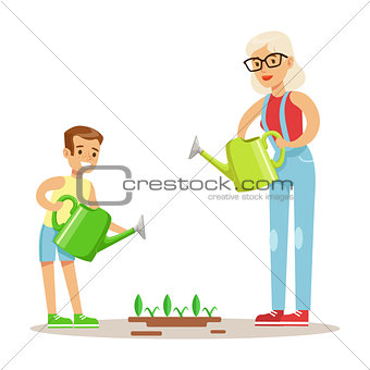 Grandmother And Boy Watering Plants, Part Of Grandparents Having Fun With Grandchildren Series