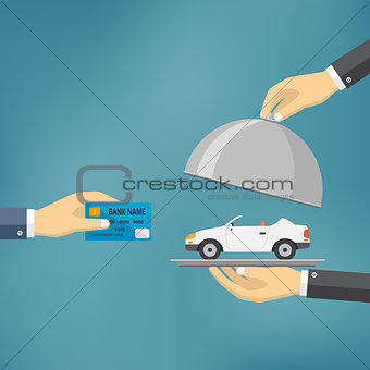 Hands holding credit card and cloche with car.