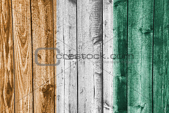 Flag of  Ivory Coast on weathered wood