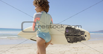 Female walks to sea to surf