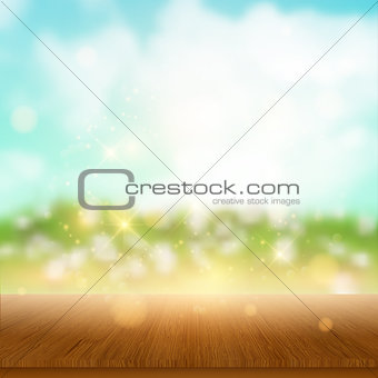 Wooden table looking out to summer landscape