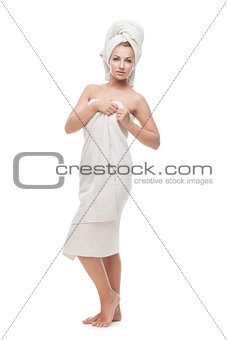 Beautiful girl standing in towel