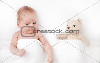 New born Baby girl sleeping with her teddy bear