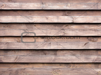 Texture of a wooden fence with a new horizontal brown background