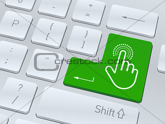 Hand click concept on button of white computer keyboard.