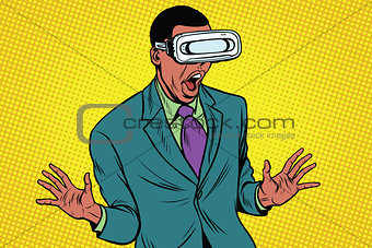 Shocked African American in VR glasses