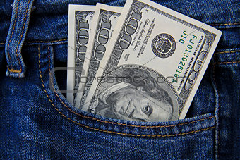 American dollar banknotes in jeans pocket