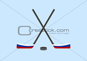 Hockey sticks and puck with the Russian flag