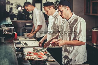 Preparing sushi set in restaurant kitchen