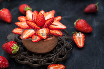 Mini chocolate cheesecake  dessert decorated with fresh strawber