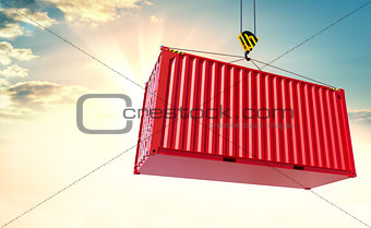 Crane hook and cargo container on sky background