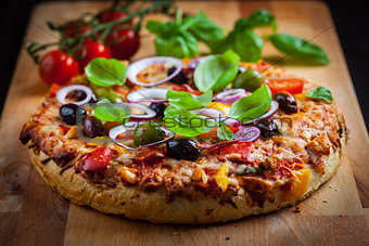 Traditional homemade pizza with tomatoes and olives