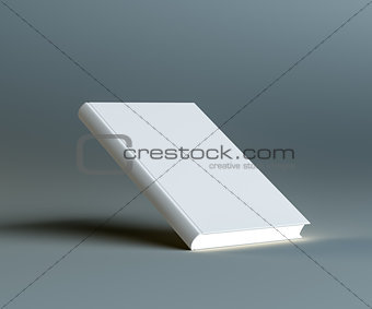 A closed white empty book stands on the corner