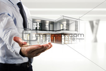 Businessman showing a modern office project